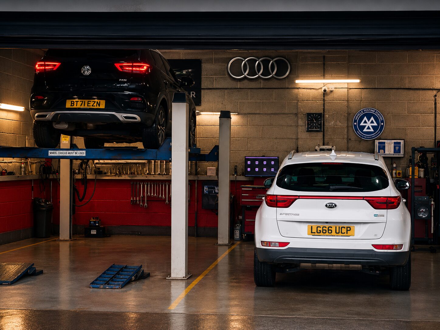 Red Lion garage interior with vehicles on lifts